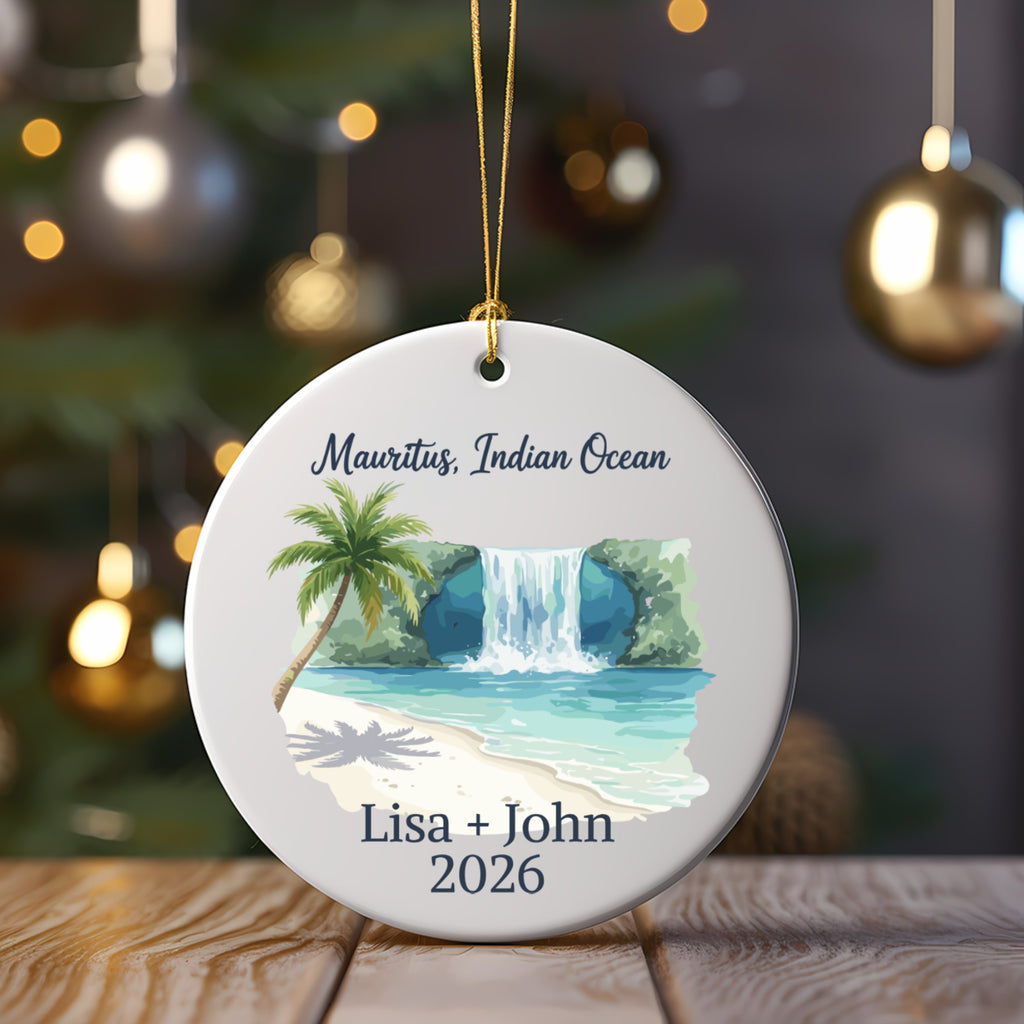 Ornament with beach, waterfall, palm tree, "Mauritius, Indian Ocean", and names.