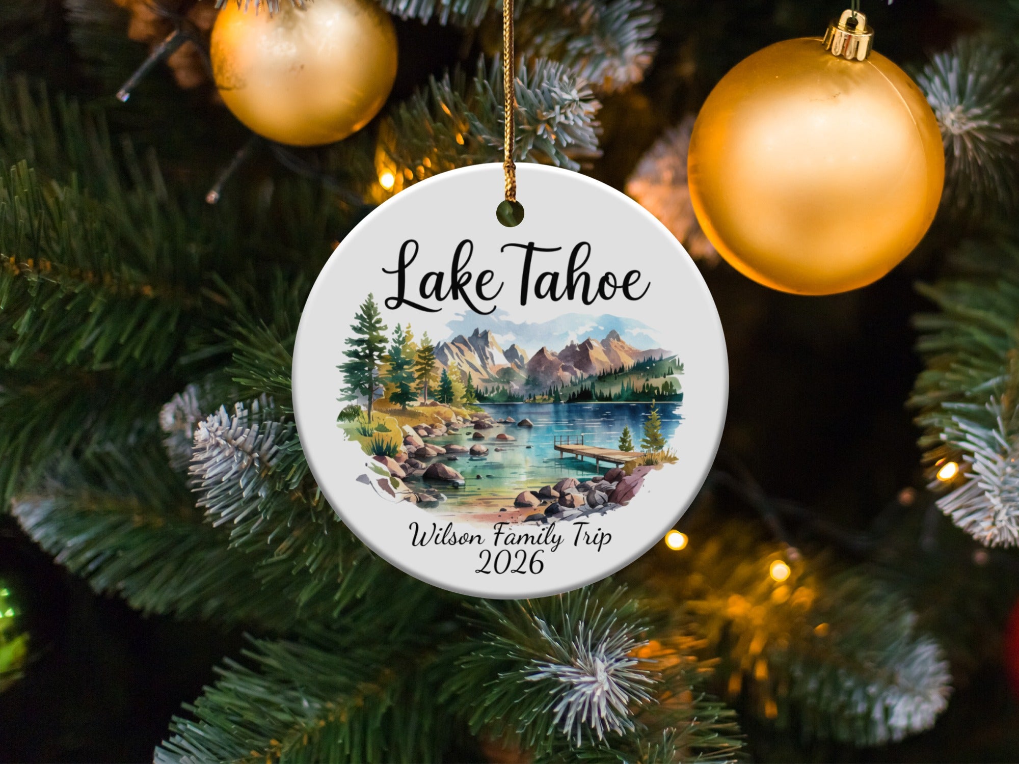 Round ornament with Lake Tahoe scene and "Wilson Family Trip 2026" text.