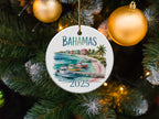 Bahamas 2025 circular ornament with boats and buildings on water.
