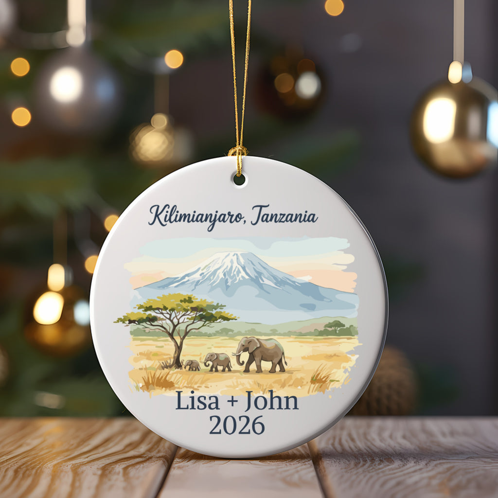 Round ornament with Kilimanjaro, elephants, and personalized text.