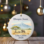 Round ornament with Kilimanjaro, elephants, and personalized text.