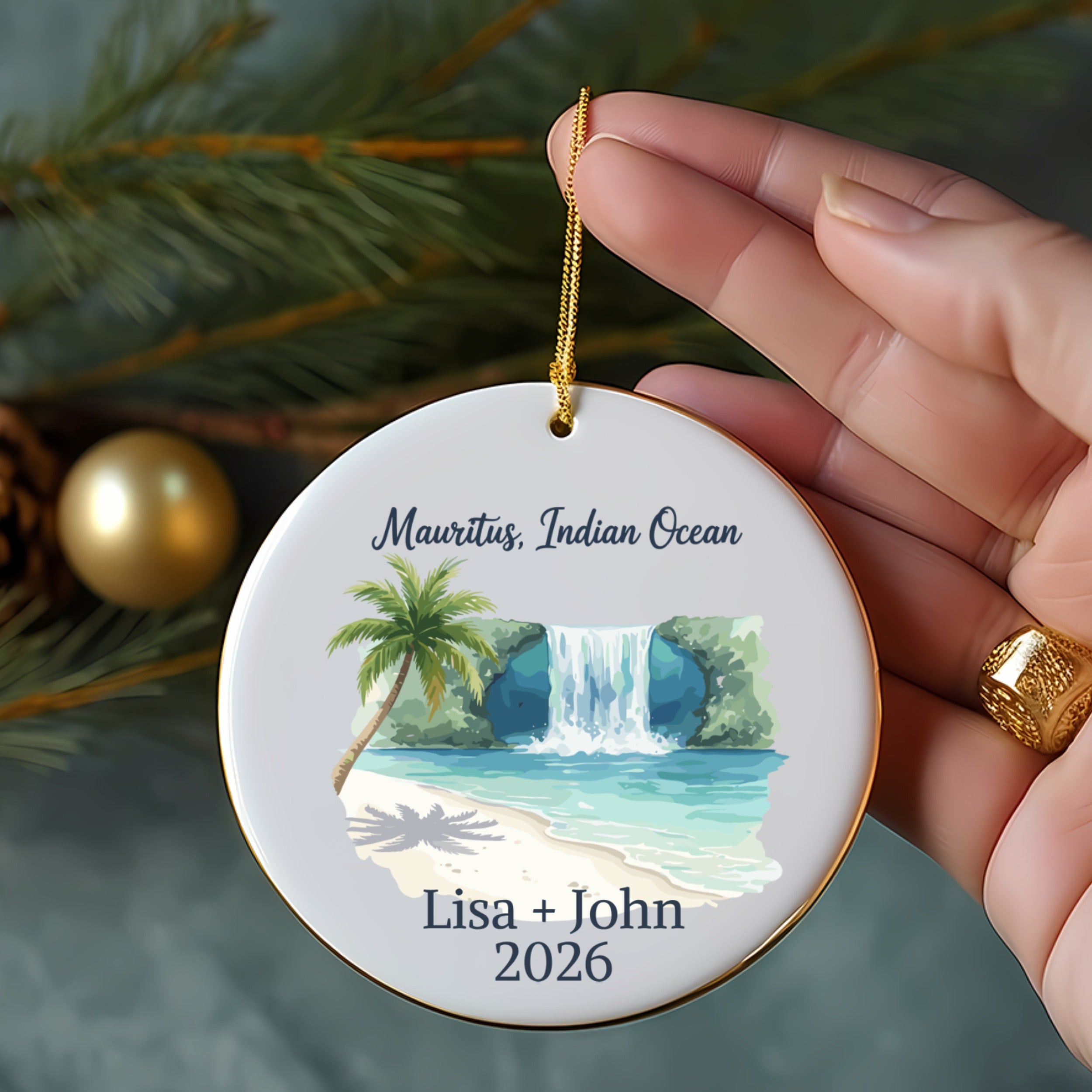 Round ornament with waterfall scene, palm tree, beach, "Mauritius, Indian Ocean Lisa + John 2026."