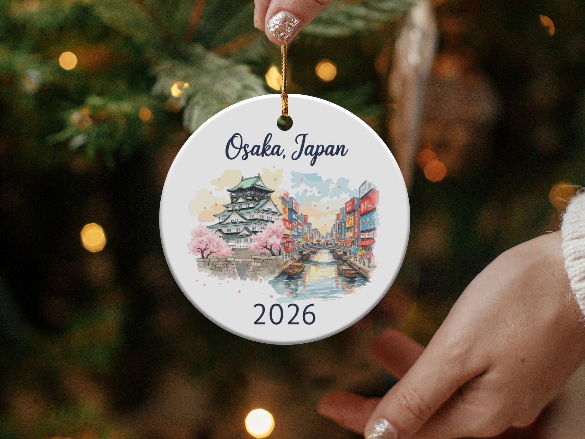Osaka, Japan ceramic ornament with castle and cityscape illustration, dated 2026.