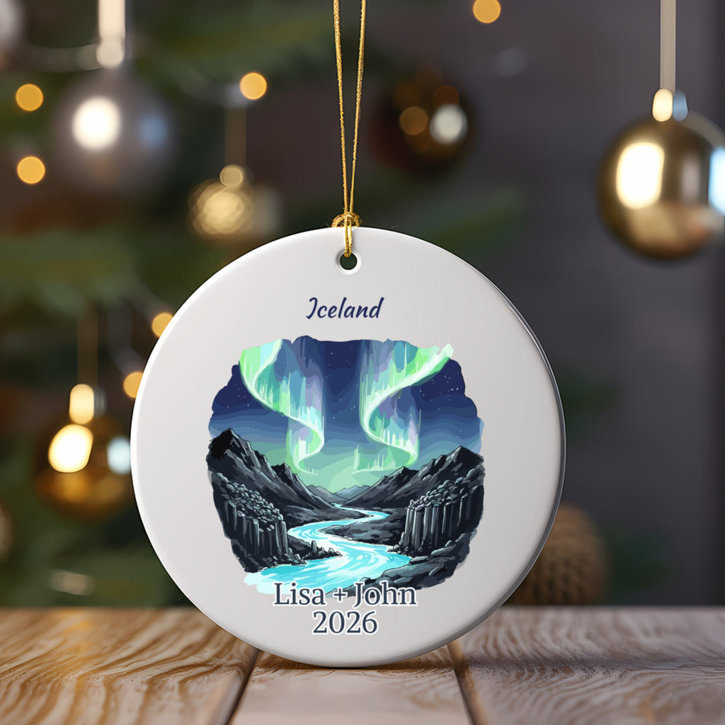Round ornament with Iceland landscape, northern lights, and personalized text.