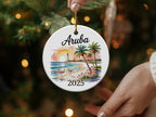 Round Aruba ornament with flamingos and palm trees, dated 2025.