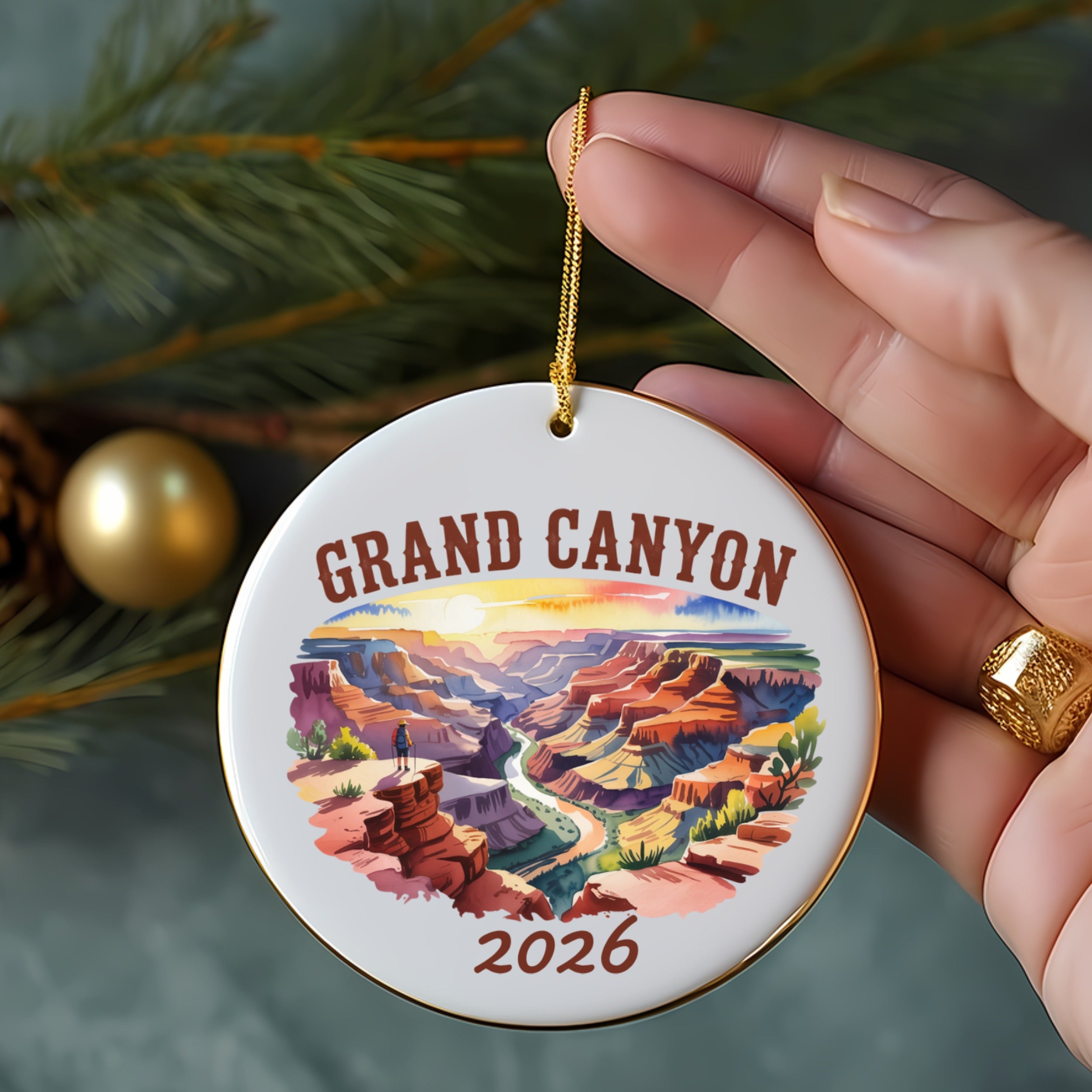 Grand Canyon 2026 ornament with a person overlooking the canyon at sunset.