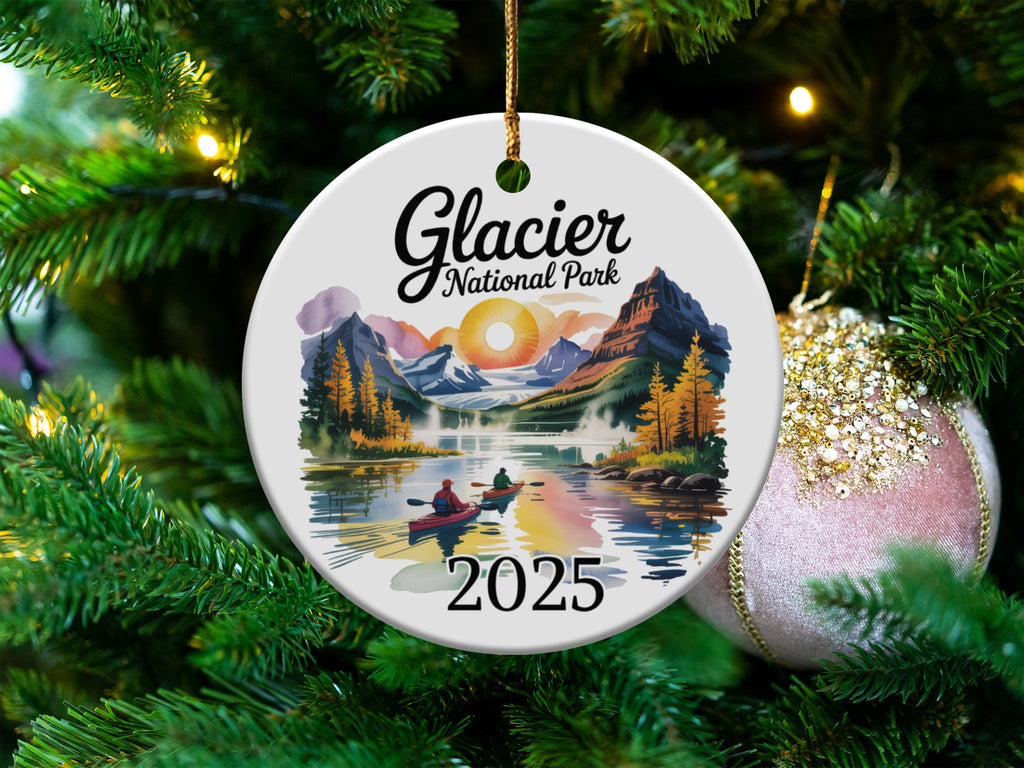 Glacier National Park ornament with a lake, mountains, and kayakers, dated 2025.