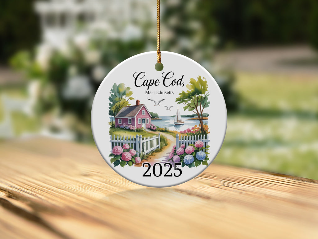 Cape Cod, Massachusetts 2025 ceramic ornament with a house and water scene.