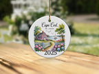 Cape Cod, Massachusetts 2025 ceramic ornament with a house and water scene.