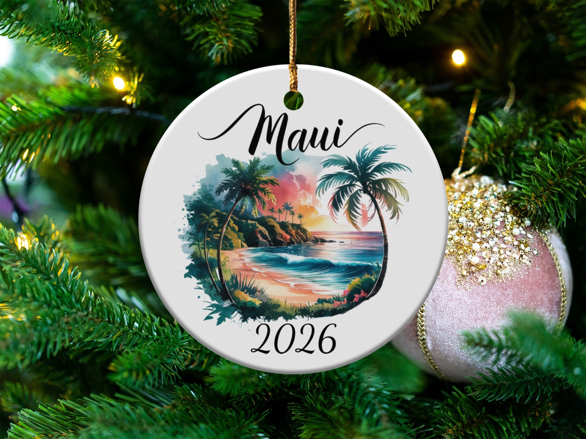 Round ornament with Maui beach scene and "2026" text.